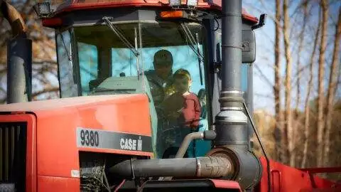 A & L Potato Co. – Father and son in a tractor