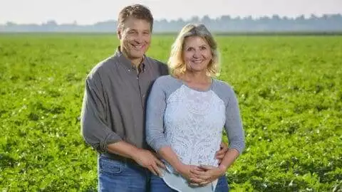 Nuto Farms parents standing in potato field