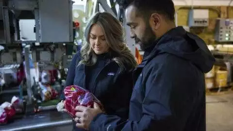 A & L Potato Co. - Jenni and Frank looking at Farmer's Promise Potato Bag