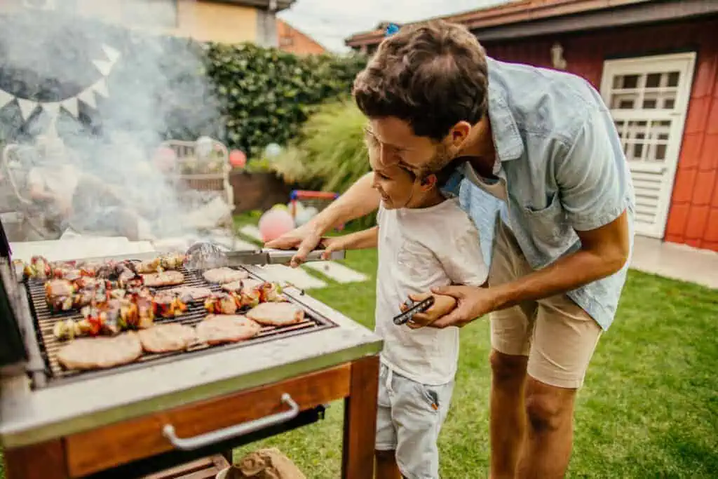 Father and son grilling