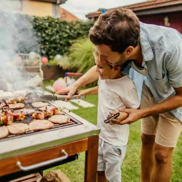 Father and son grilling
