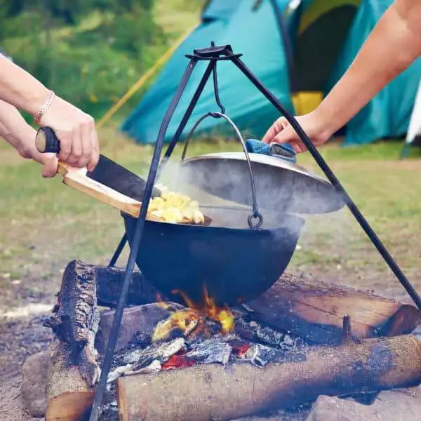 Cooking potatoes over a campfire